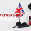 An image of the UK flag with the US flag and cirrus research plc noise measurement devices